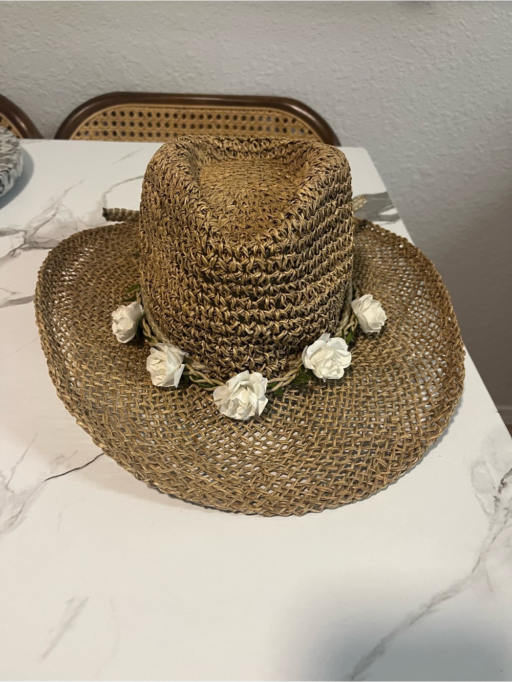 Cowboy style straw hat with floral headband